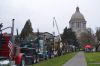 Dozens of logging trucks parked in front of the state Capitol in Olympia March 2 as part of a show of force by loggers and