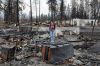 Climate activist Niria Garcia stands amid the burned-out remains of her father's home in Phoenix, Ore. His house and the