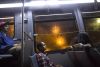 Roel "RJ" Williams, 22, rides a bus home after finishing his shift at Top Pot Doughnuts in Renton, Wash. on 9/29/2013. RJ