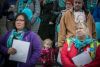 Foster parents and their families gather on the steps of the Washington State Capitol in Olympia for a rally on Jan. 17.