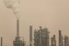 Emissions from the Marathon Oil refinery in Anacortes, Washington, mix with a blanket of wildfire smoke in September 2020.