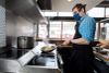xecutive chef Stuart Lane preparing cavatelli con asparagi — pasta with asparagus and spring onions — on the induction