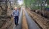 Marc Thalacker, the manager of Three Sisters Irrigation District, standing on a newly installed water pipeline