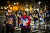 Susan Lee Woo, red jacket, is one of the leaders of a private block watch in the Chinese International District.  At left is
