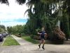 A jogger passes big trees on private land in Queen Anne. Photo by Adiel Kaplan/InvestigateWest