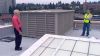Paul Wight, a project manager on the John Marshall renovation, shows KING 5's Chris Ingalls
    the air intake on the
