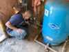 In this April 2022 file photo, Morrow County resident Annie Philpott shows part of her home's water system, which relies on
