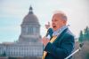 State Rep. Jim Walsh, R-Aberdeen, points to the Washington State Capitol during a 2021 rally in support of bringing back