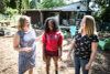 Angelique Kelley (center) was fortunate to have been adopted as a teen out of foster care by Lauren Hubbard and Reiley