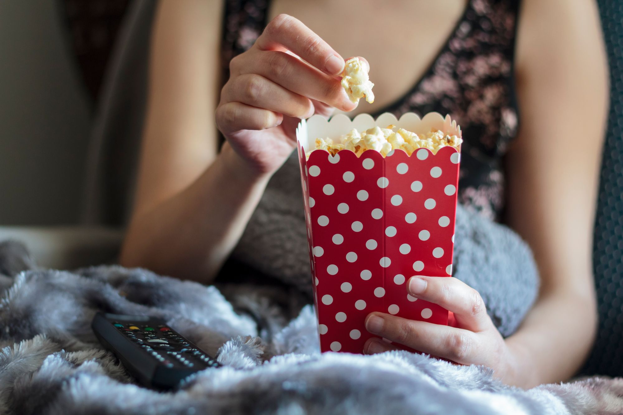 Woman eating popcorn - HomeExchange chain story