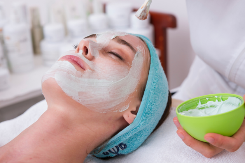 Woman in blue headband having a facial. Best things to do in London on a rainy day,