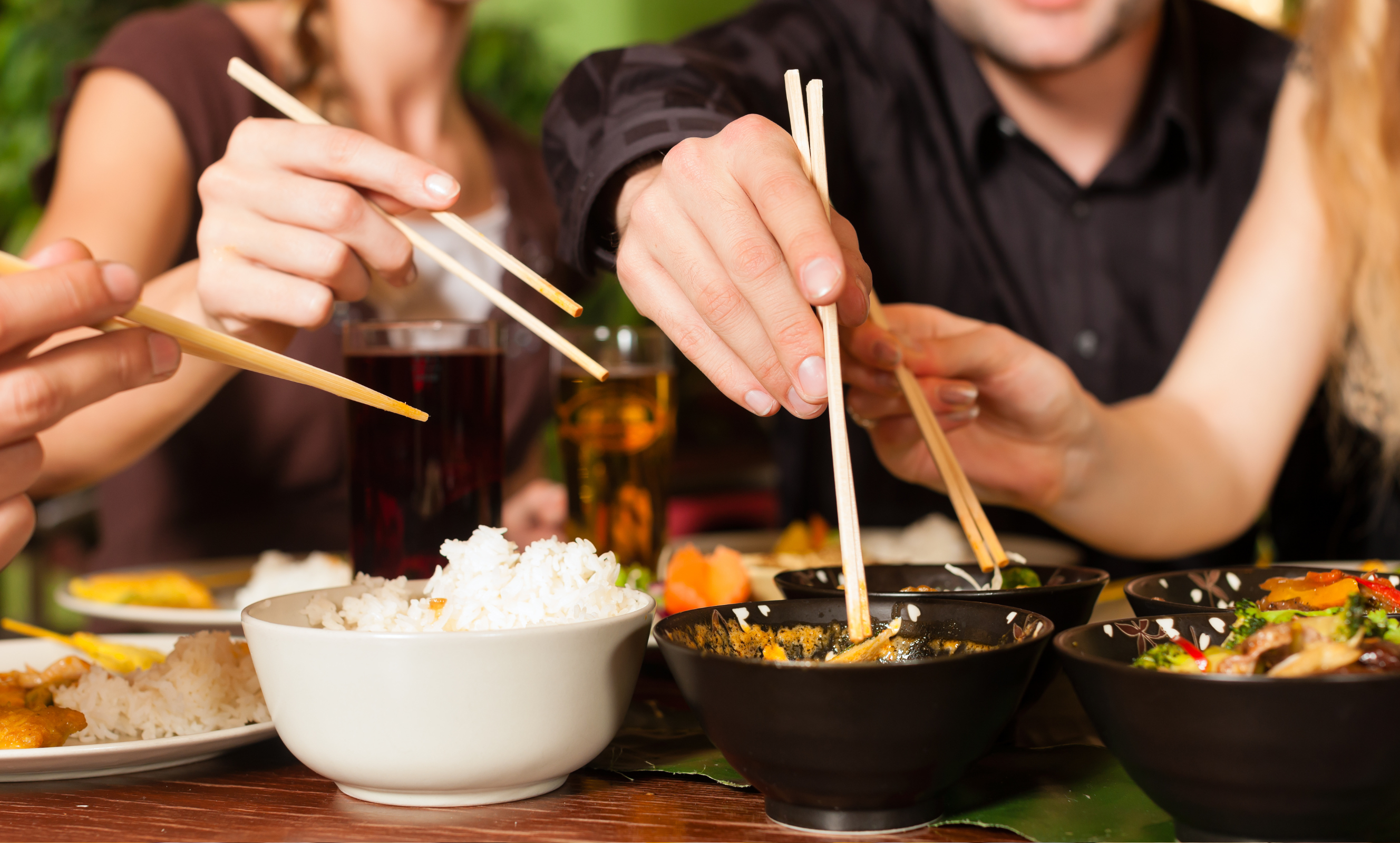 People enjoying asian cuisine
