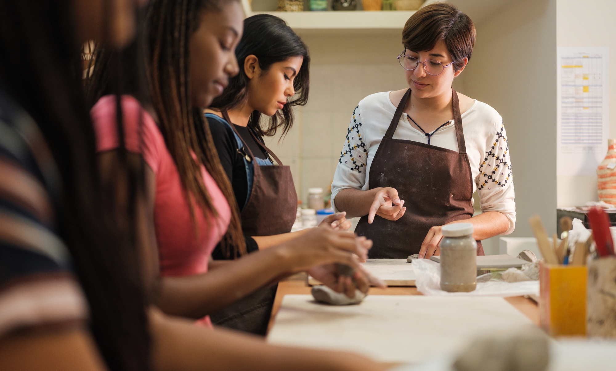 Friends taking a pottery class in San Diego