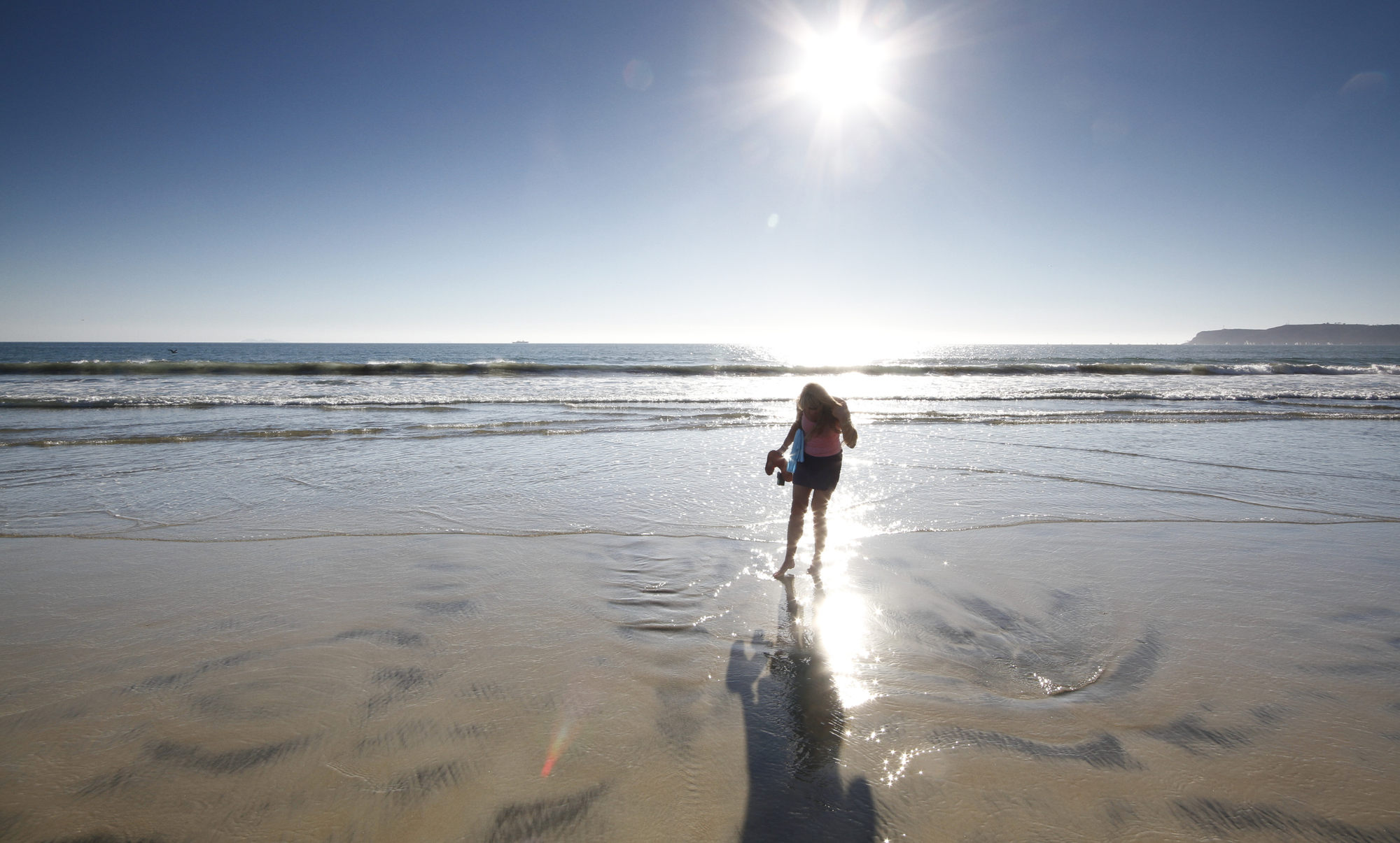 A girl at Coronado Beach as one of the things to do in San Diego for families