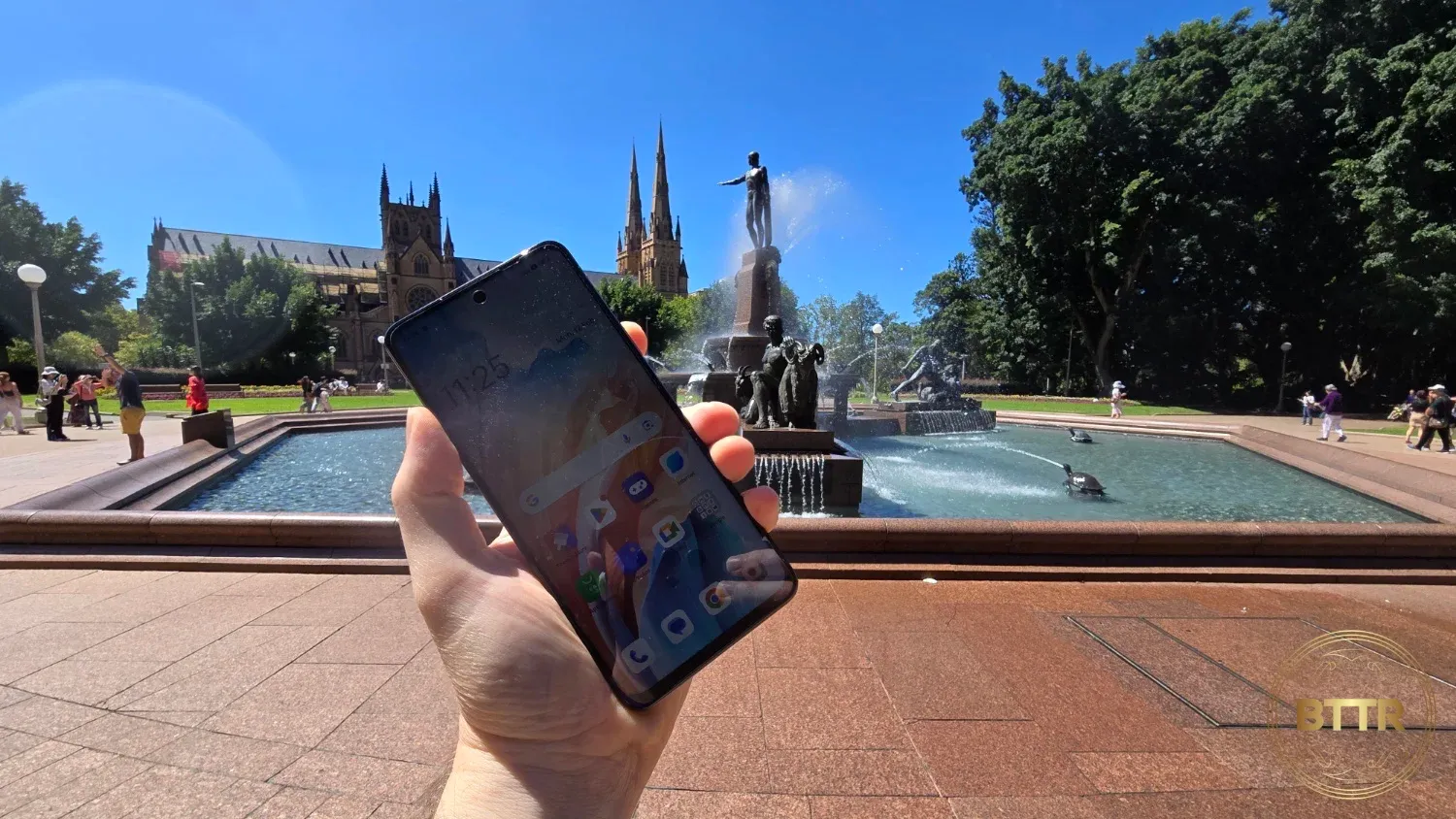 Holding the Oppo A79 5G in front of a fountain