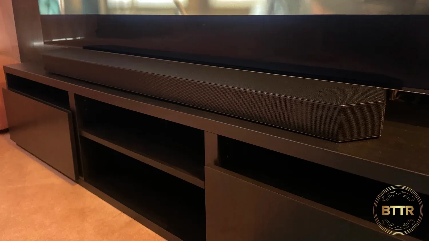 A Samsung Soundbar set up in front of a TV