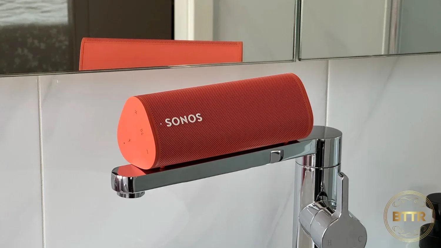 The Sonos Roam on a bathroom tap