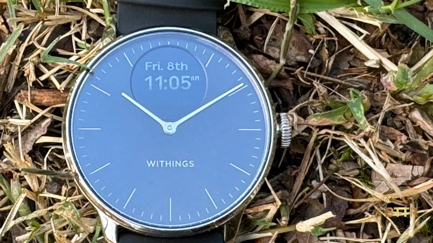 Closeup of the WIthings ScanWatch light on grass