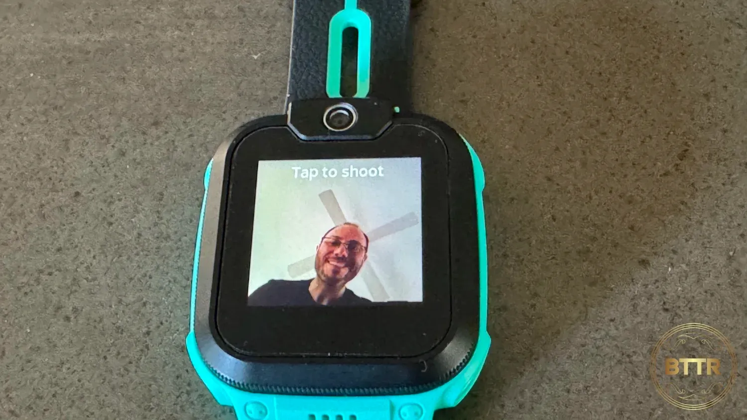 The iMoo watch taking a photo 