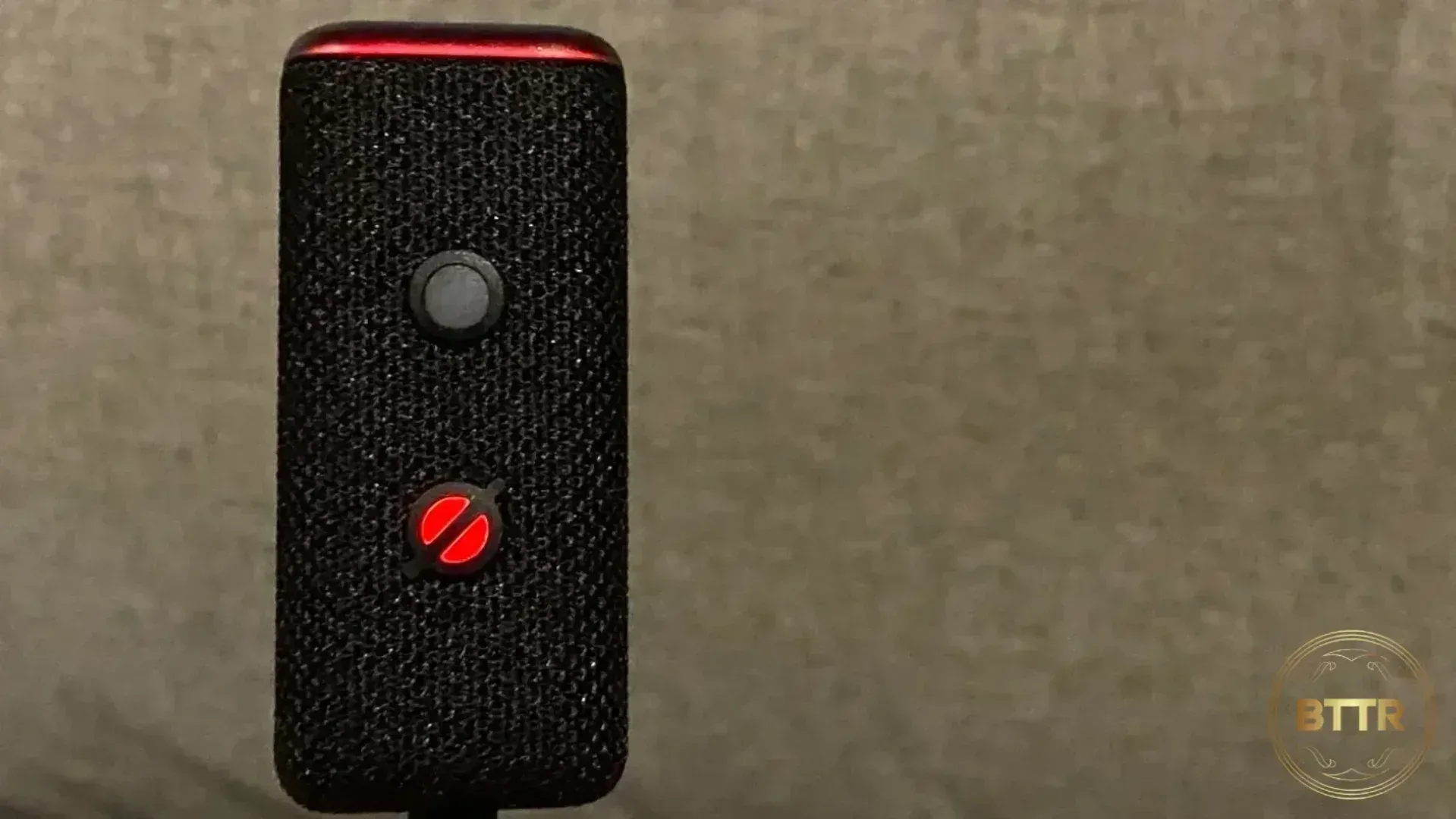 When muted, the Echo Auto glows red, indicating the mic isn't hearing you.