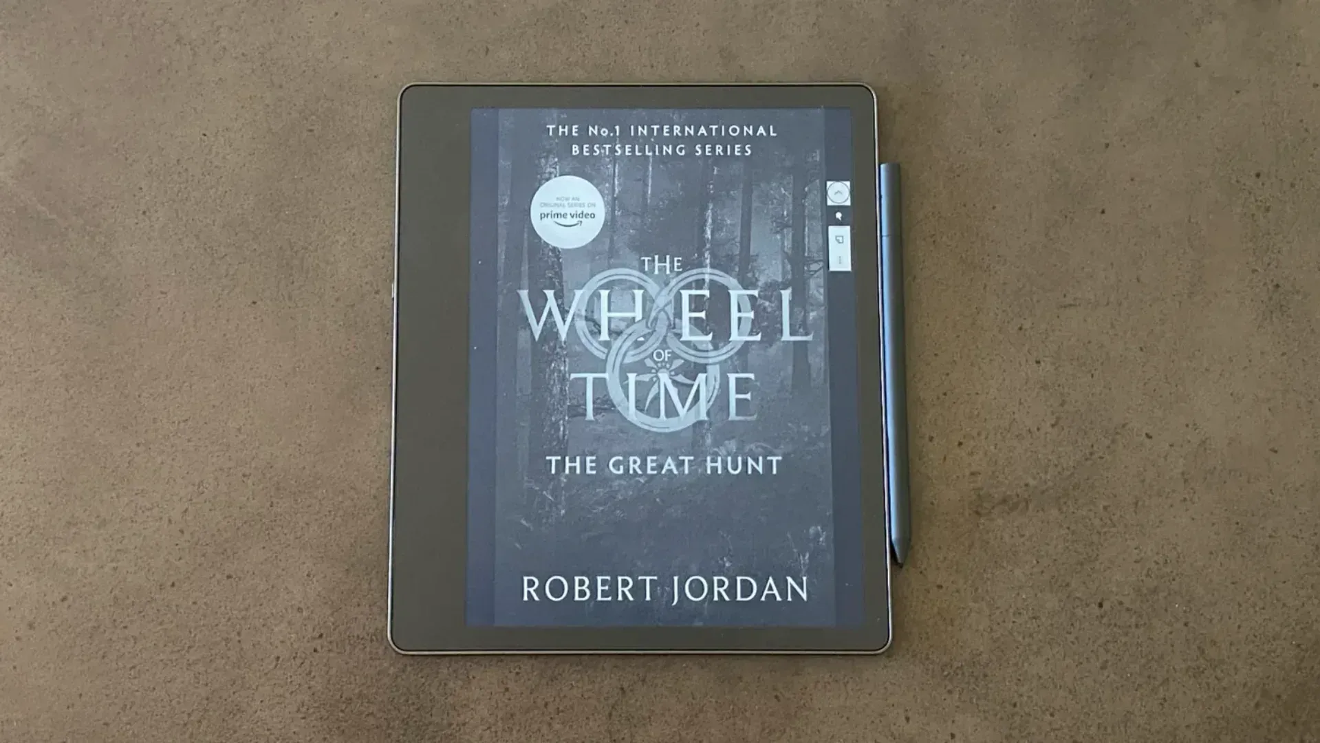 The eReader on a table about to be read.