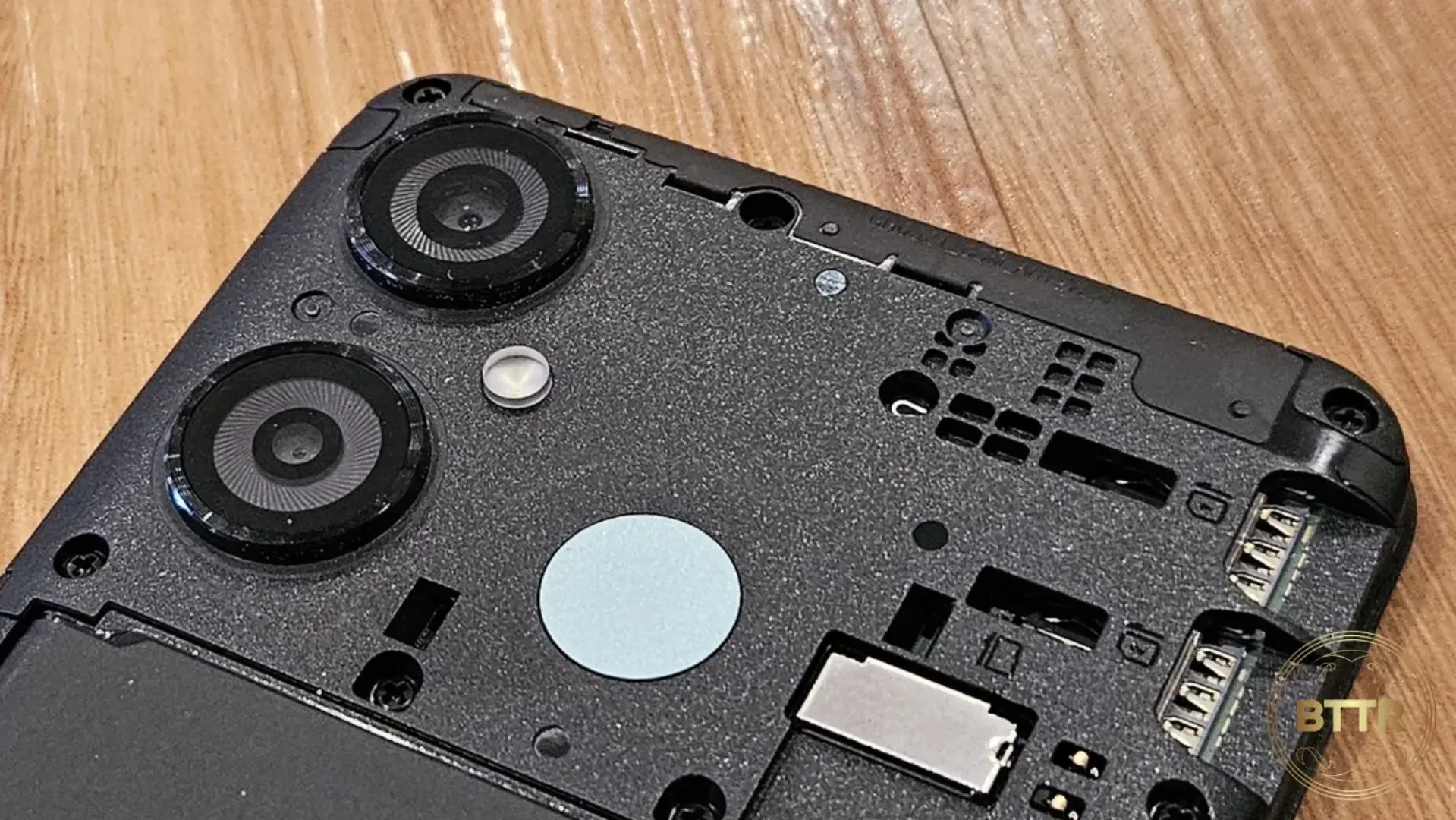 Close up of the cameras and SIM card slots inside the AS8