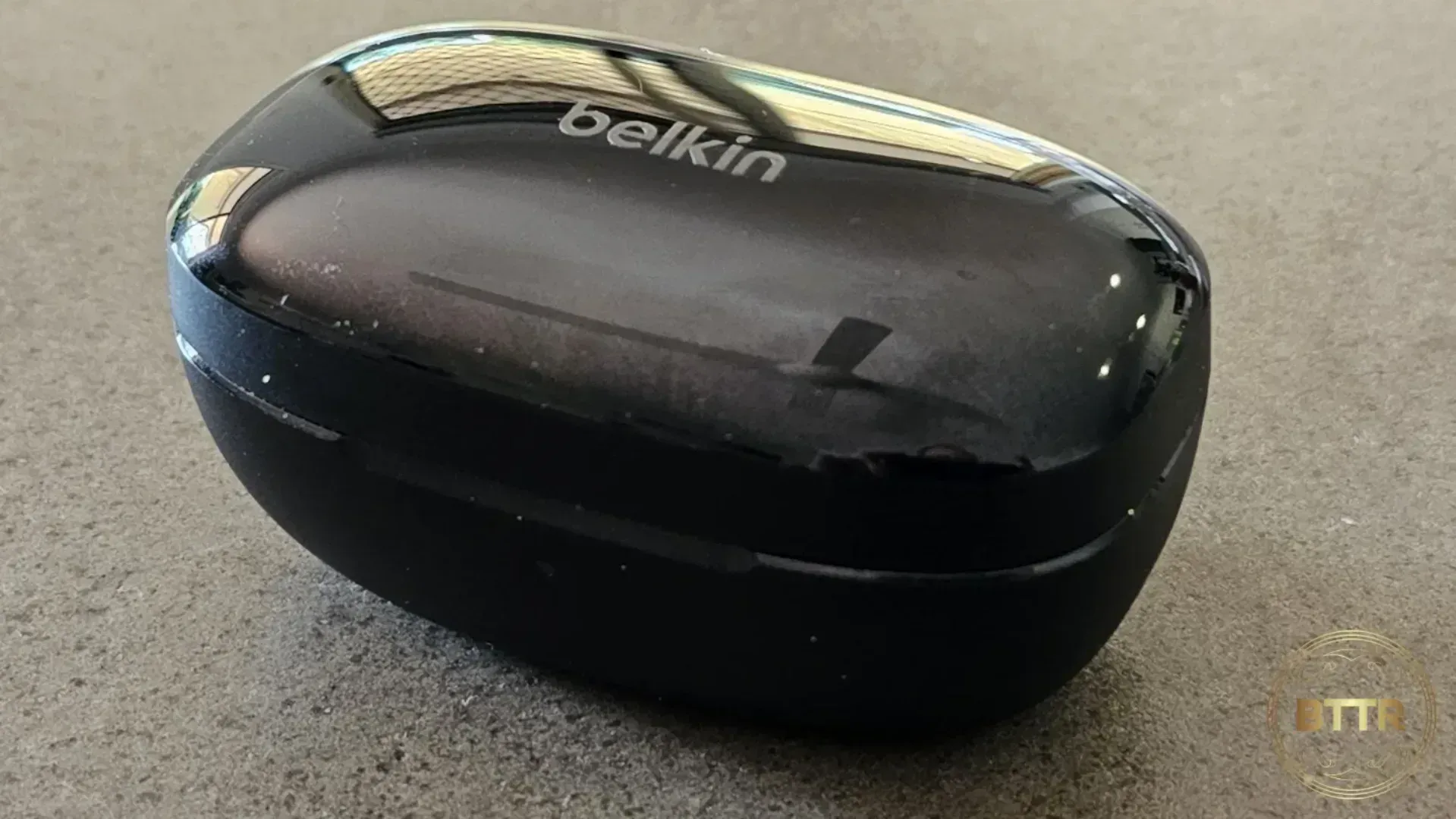 Belkin Soundform Immerse earphones on a table in the case