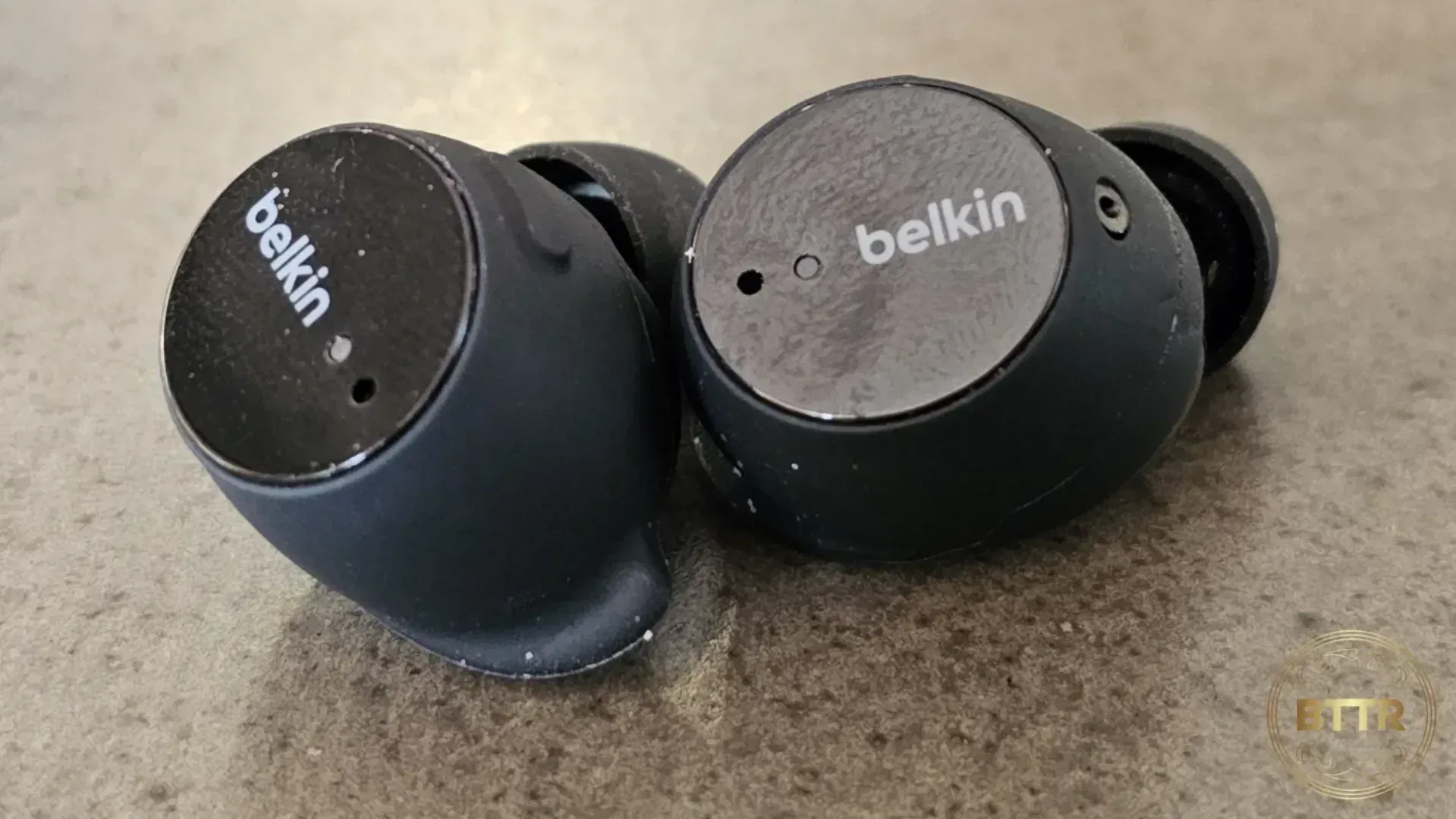 The Belkin Soundform Immerse earphones on a table