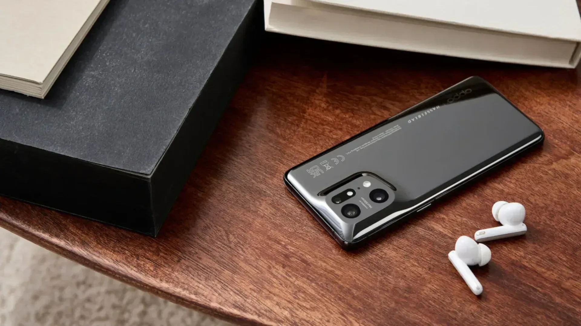 An Oppo phone next to oppo headphones