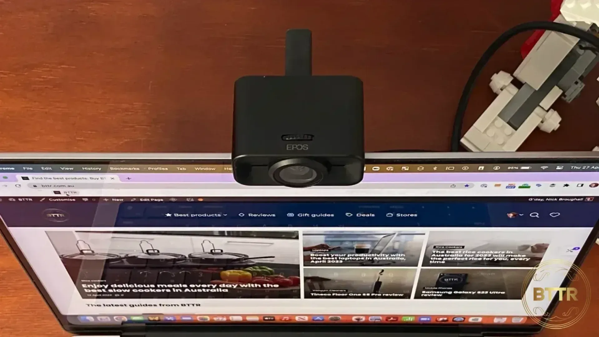 The EPOS Expand Vision 1 on top of the MacBook Pro's screen