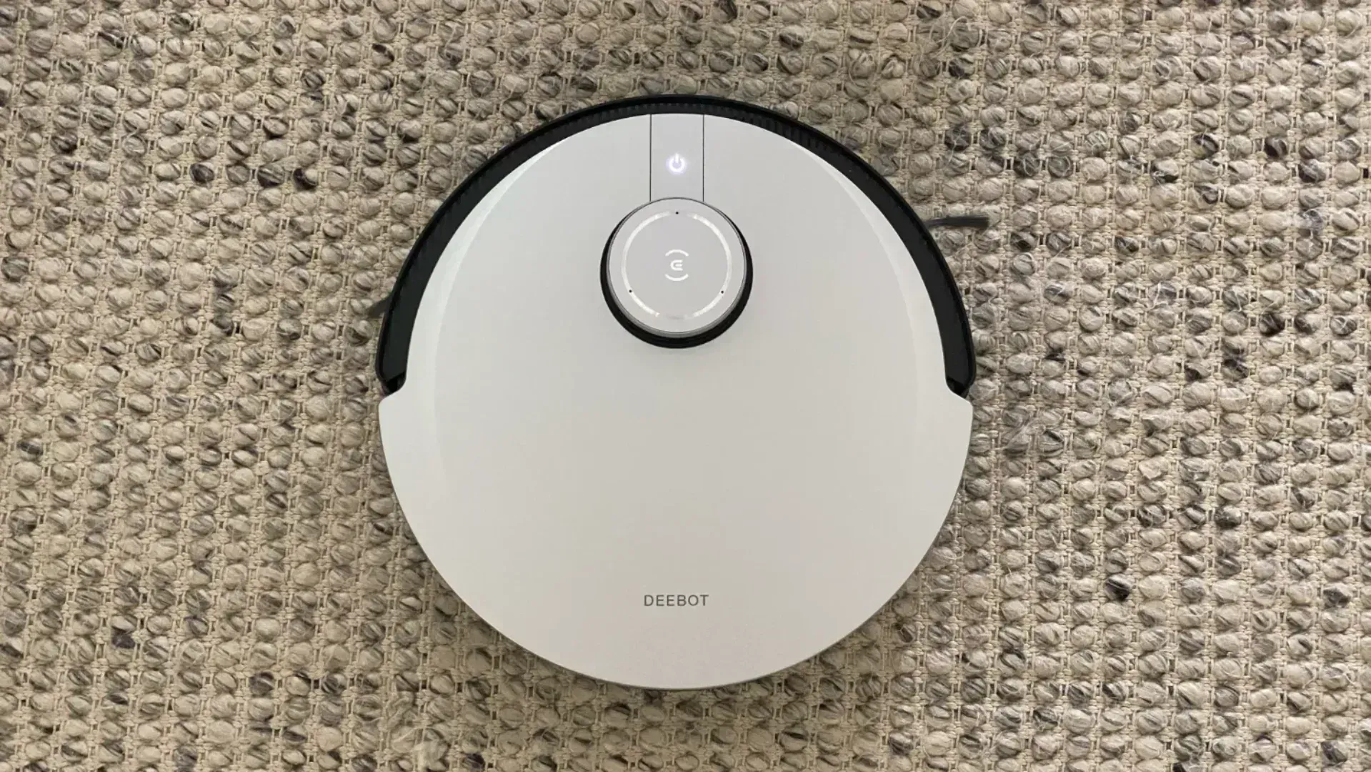 The Ecovacs Deebot X1 Plus robot vacuum on a rug