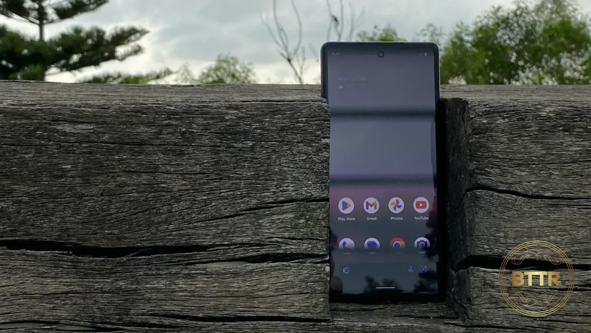 Google Pixel 6a phone in wood