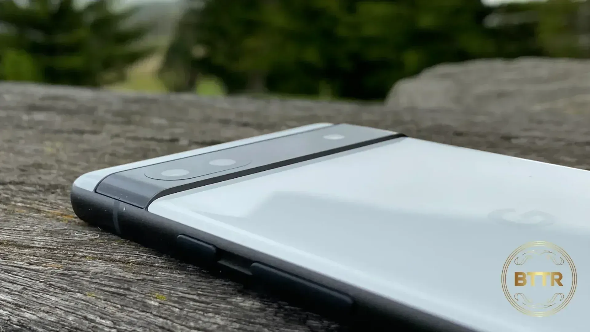 The Google Pixel 6a lying on some wood