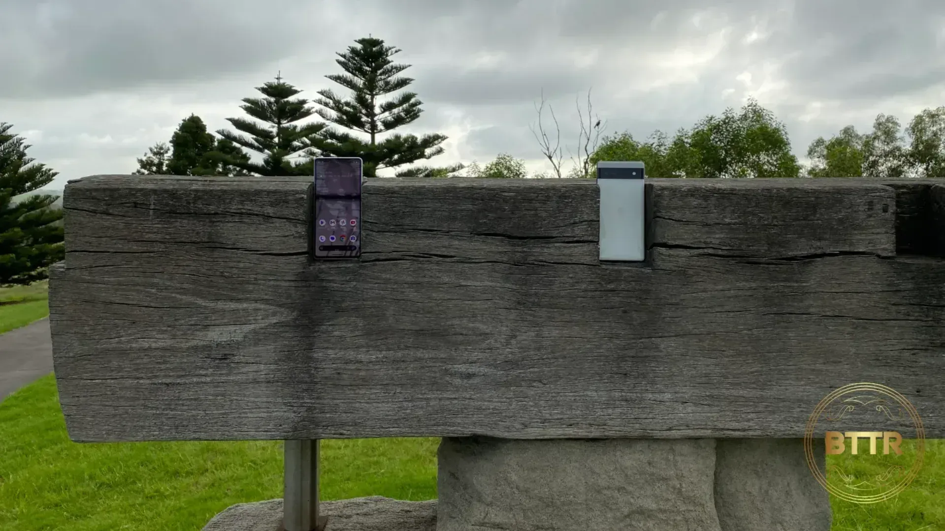 The Google Pixel 7 and Google Pixel 6a in a block of wood