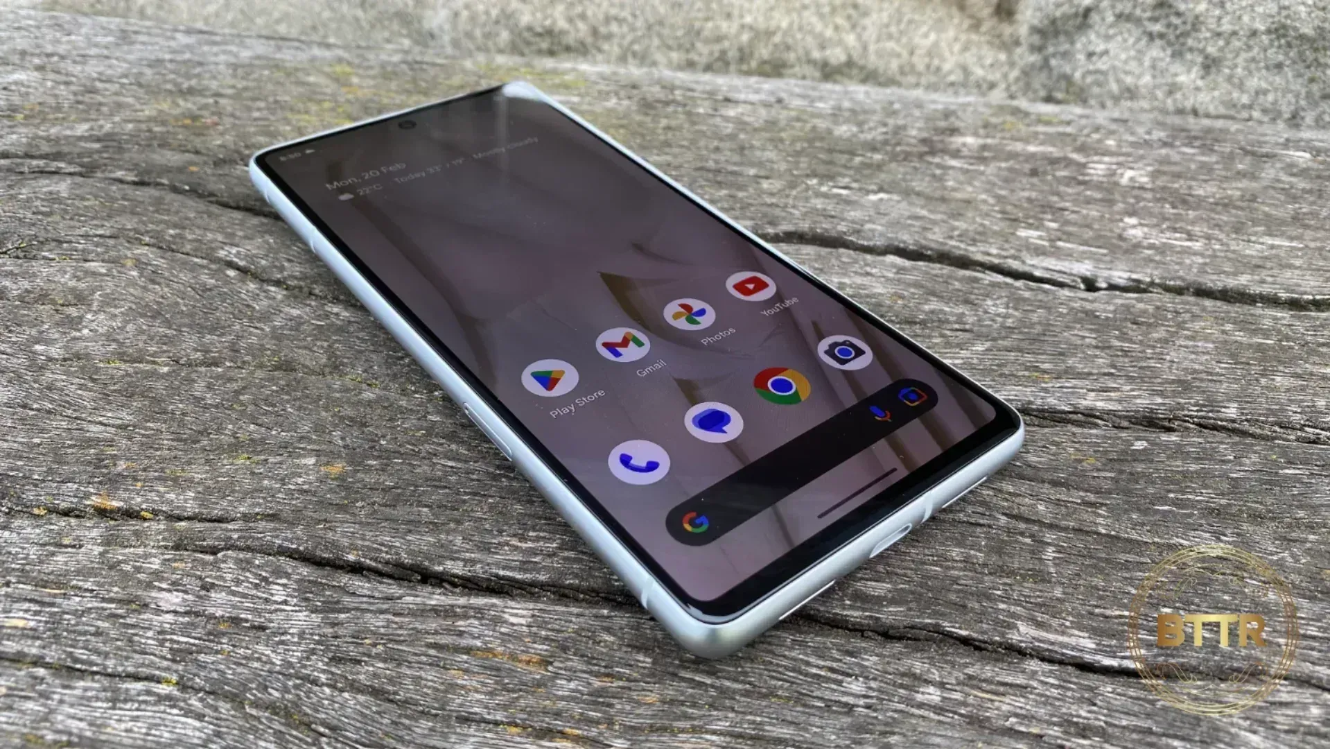 The Google Pixel 7 sitting on a wooden bench