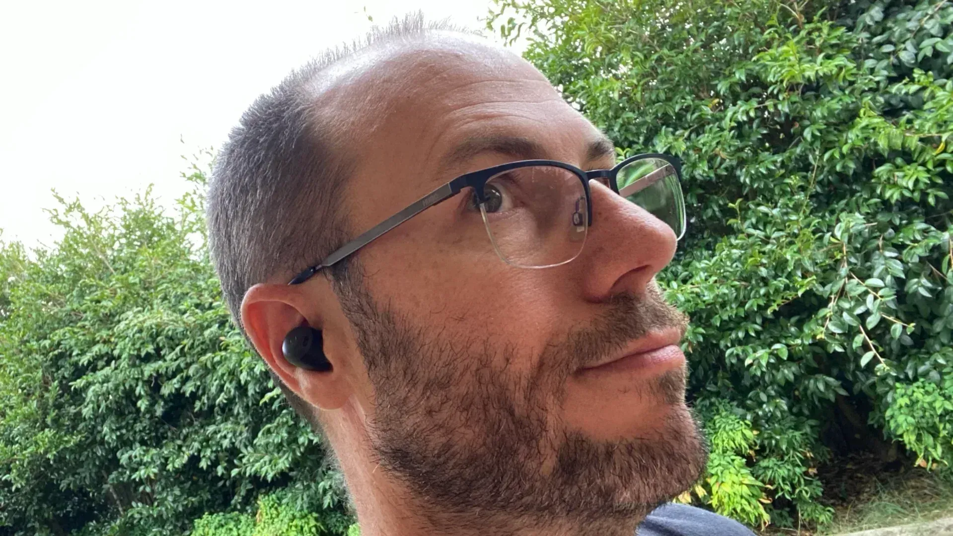 Nick Broughall wearing the Google Pixel Buds Pro for the review