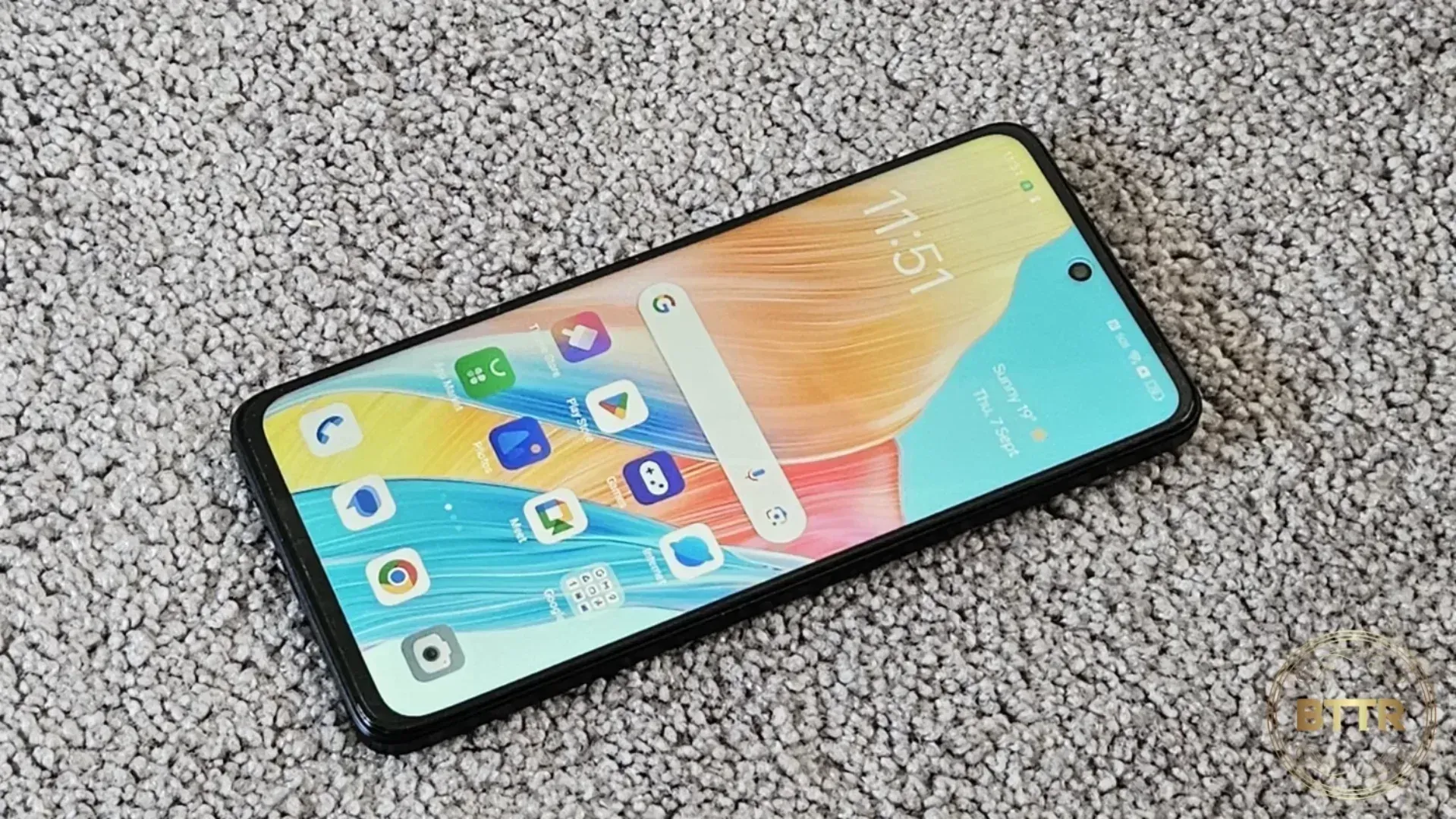 The phone lying on carpet