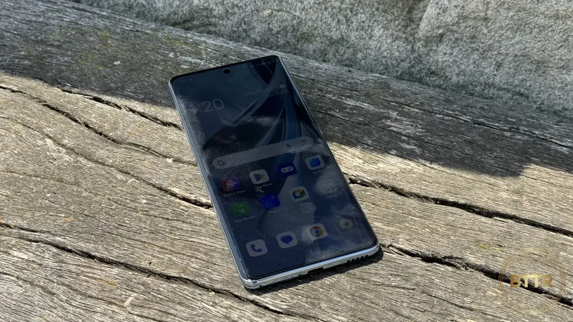 the Oppo Reno 10 5G on  a bench