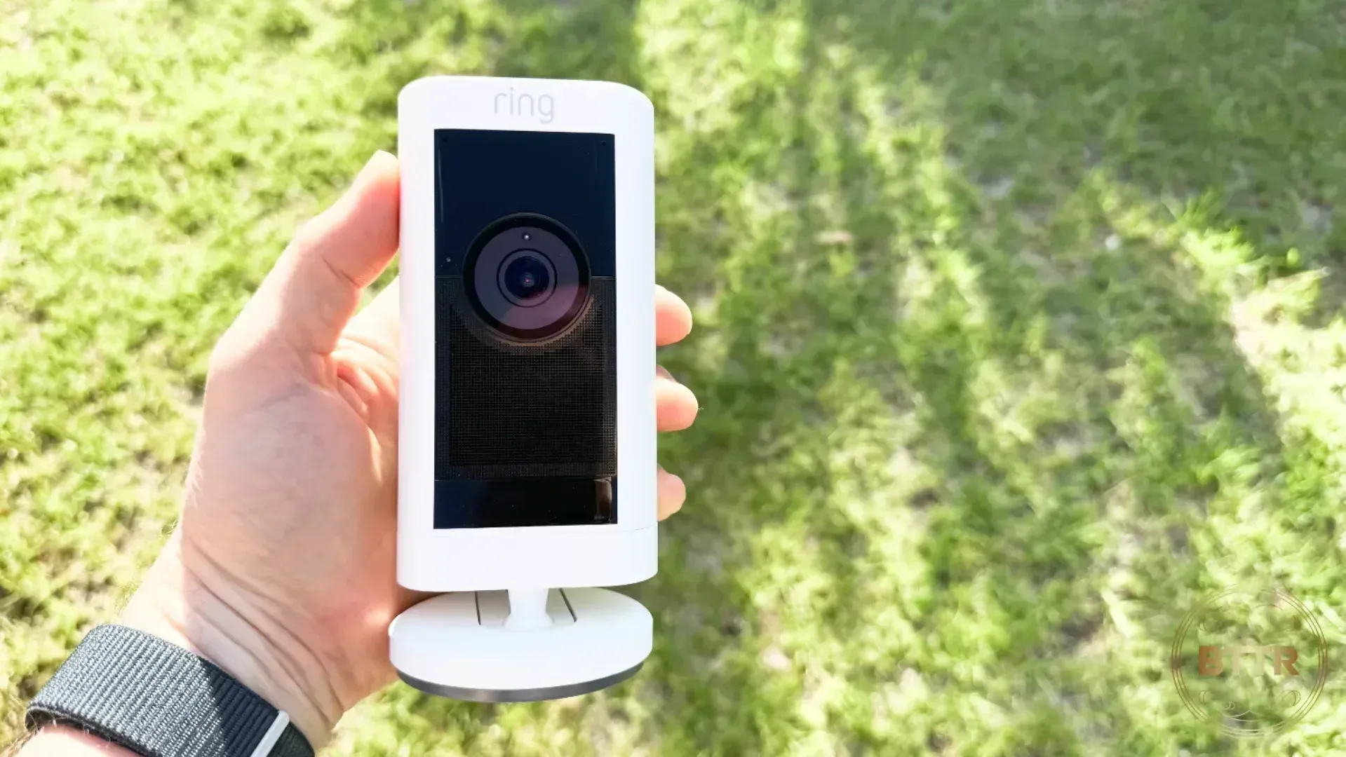 Holding the Ring Stick Up Cam Pro in the hand