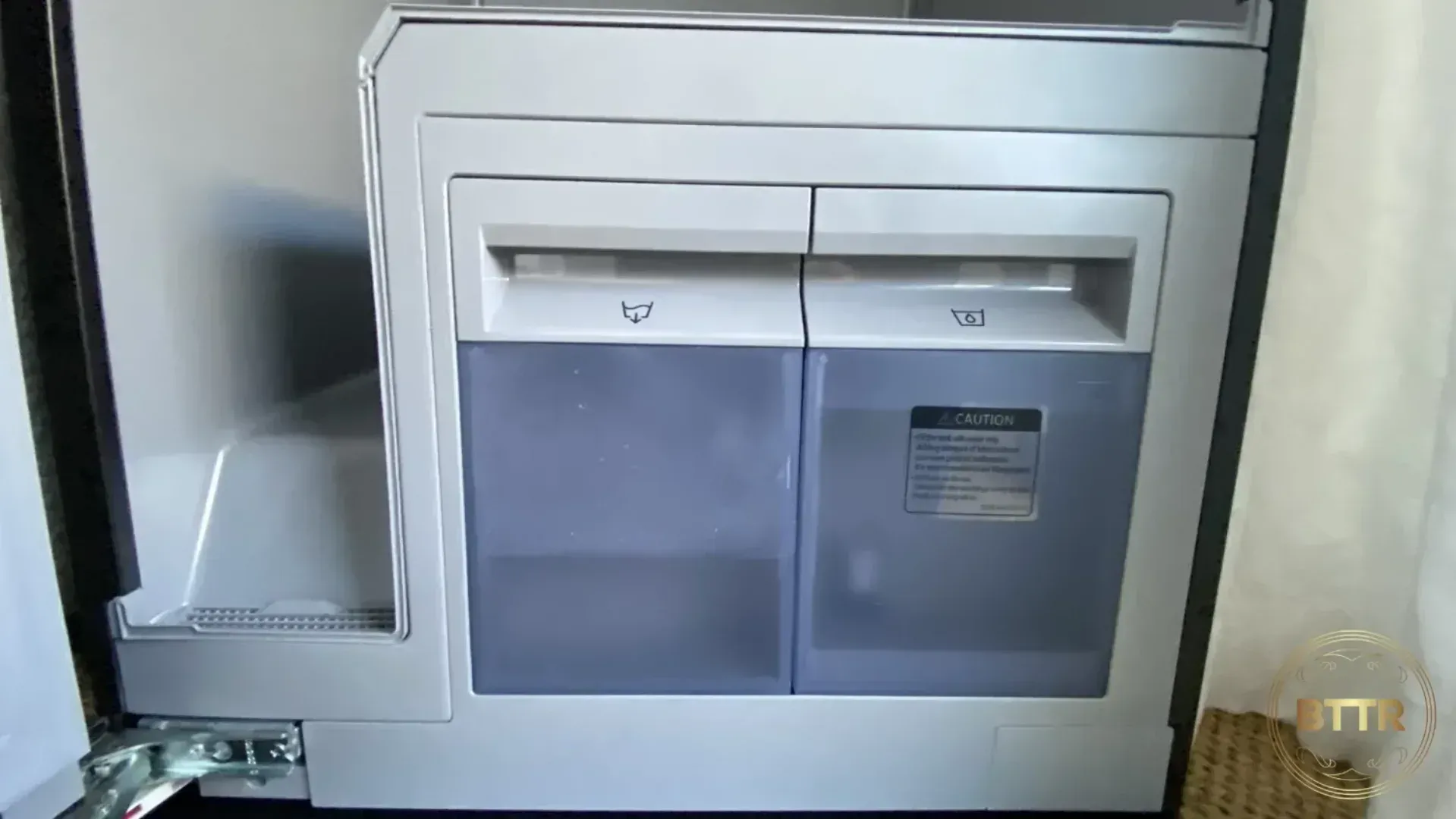 The water tanks of the air dresser. One is filled with fresh water for steam, the other is waste water from the dehumidifying action.