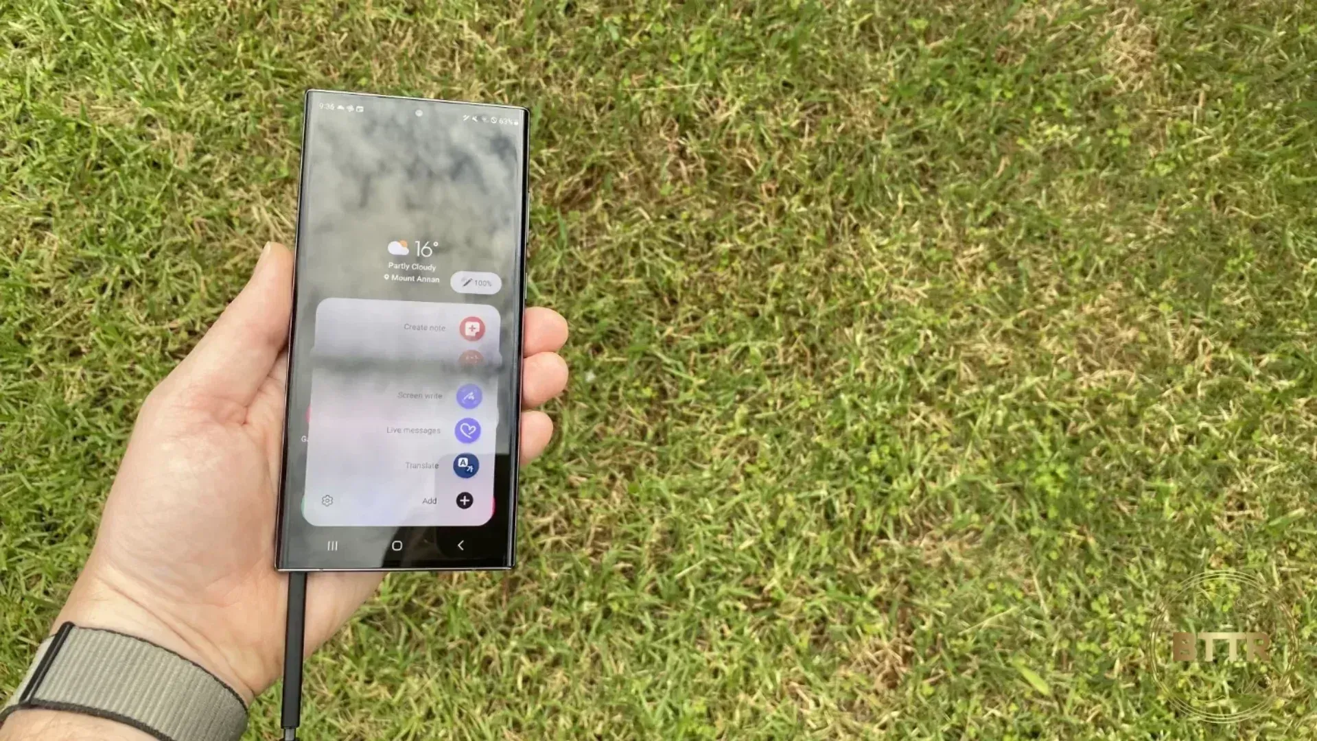 Galaxy S23 Ultra in hand with the S-Pen stylus poking out