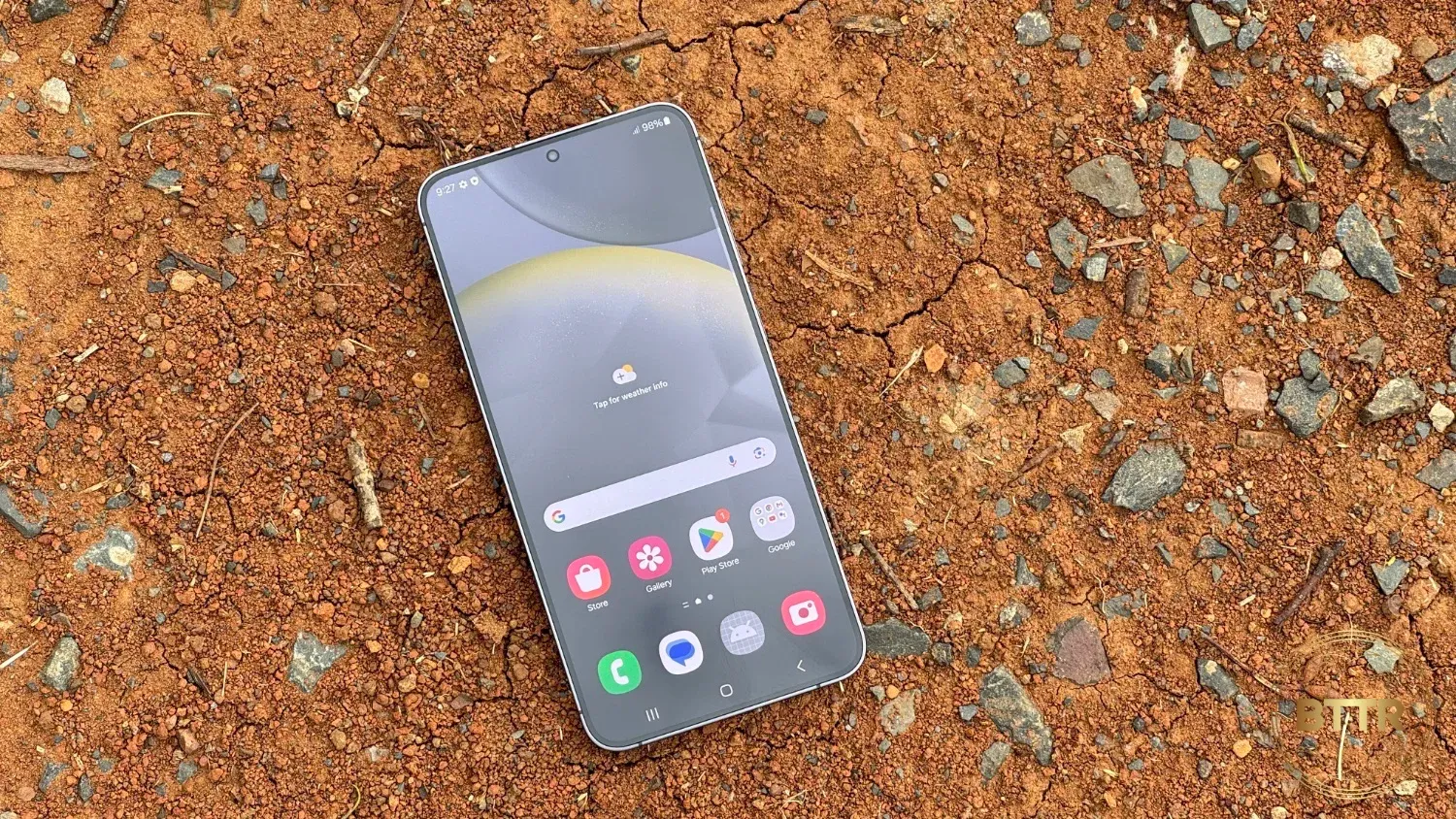 The S24 Plus on red gravel