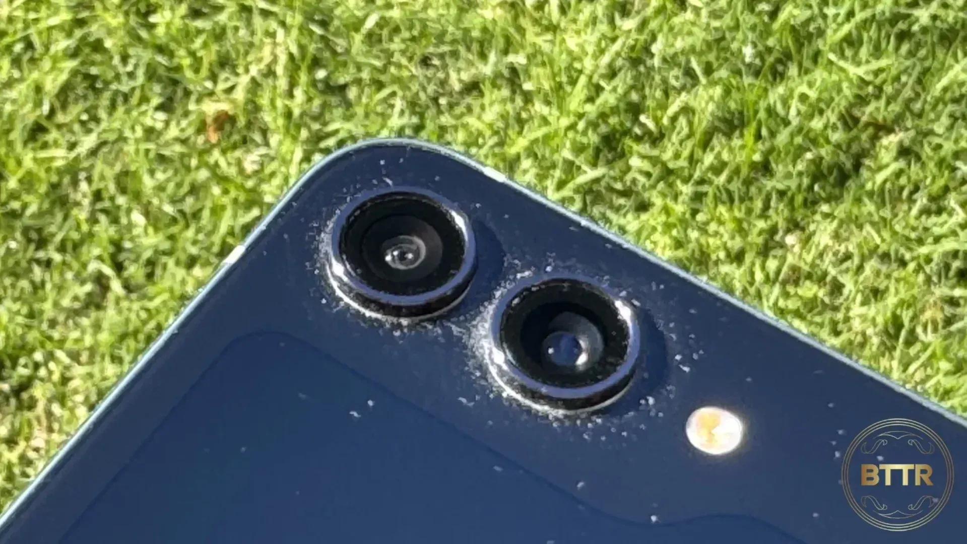 Close up of the cameras on the Z Flip 5. There's a lot of dust and lint around the lenses.
