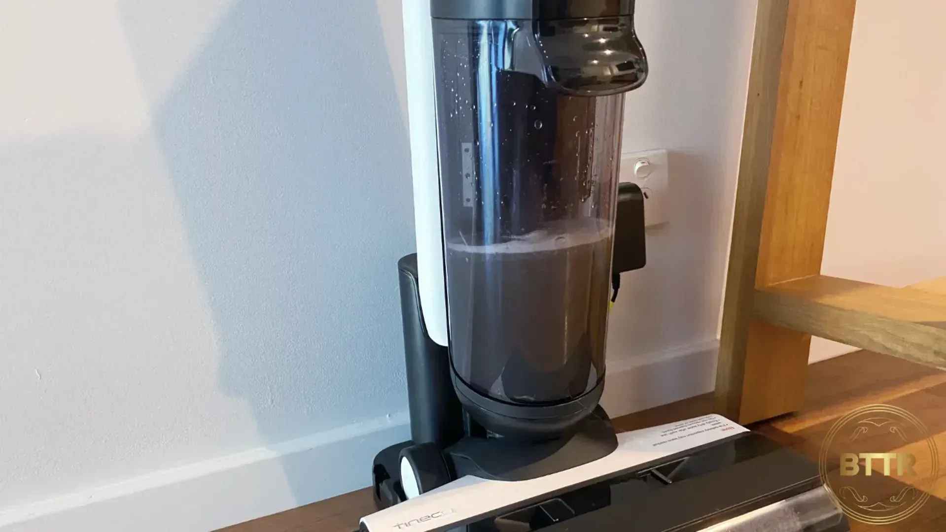 The dirty water tank on the vacuum has filled up with grey water.