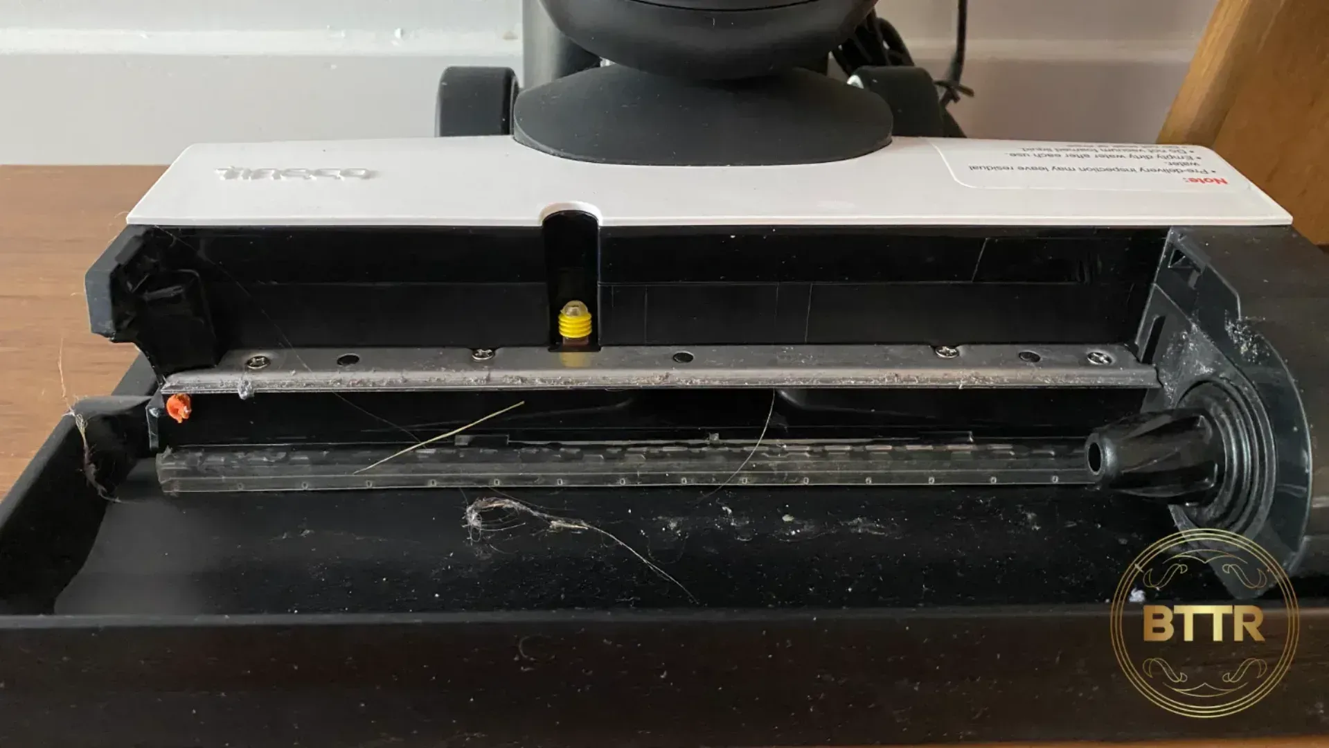 The vacuum/mop combo gets pretty gross, and you need to clean it after every use. Here you see a build up of hair and debris.