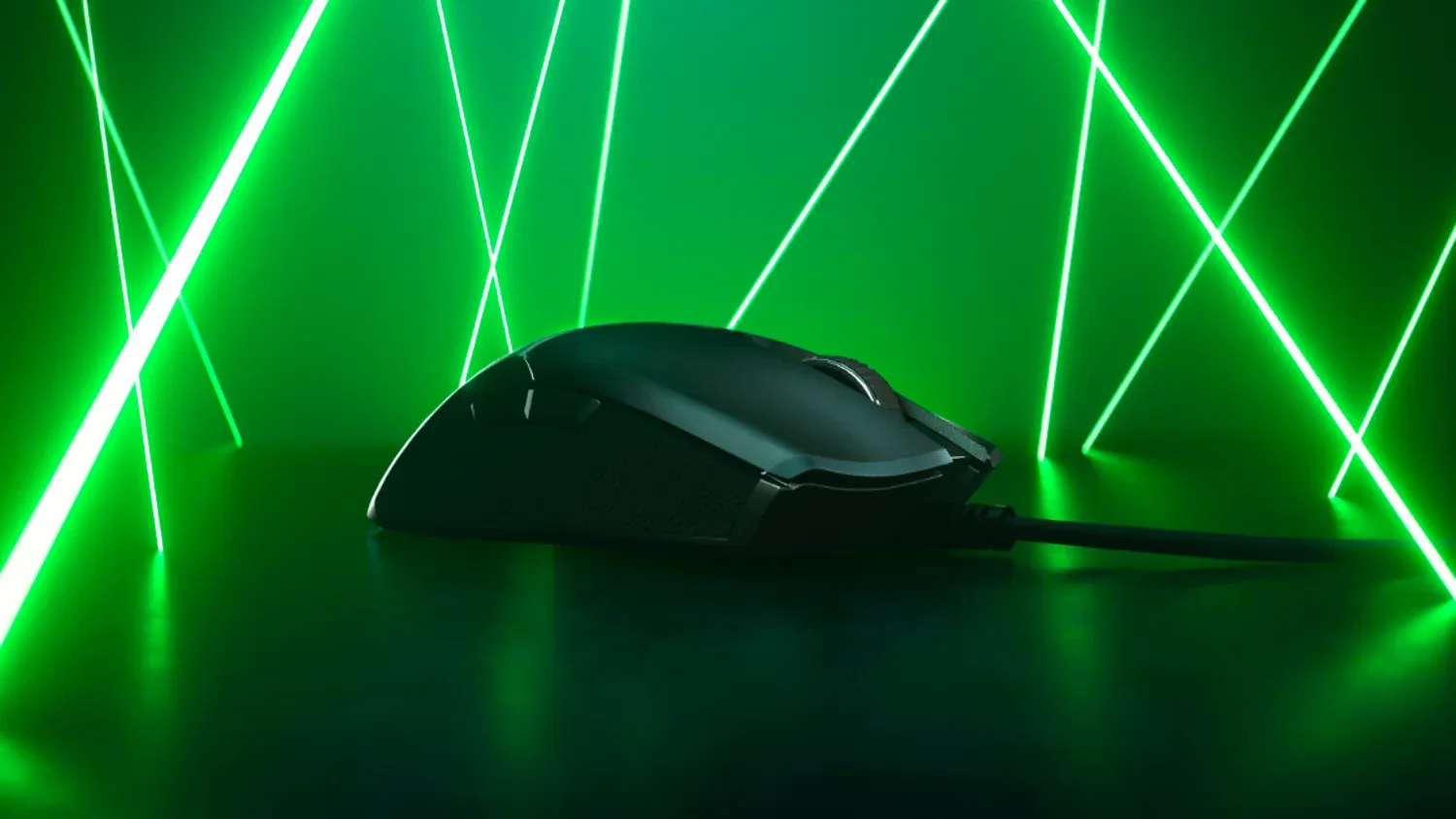 A gaming mouse surrounded by green lasers