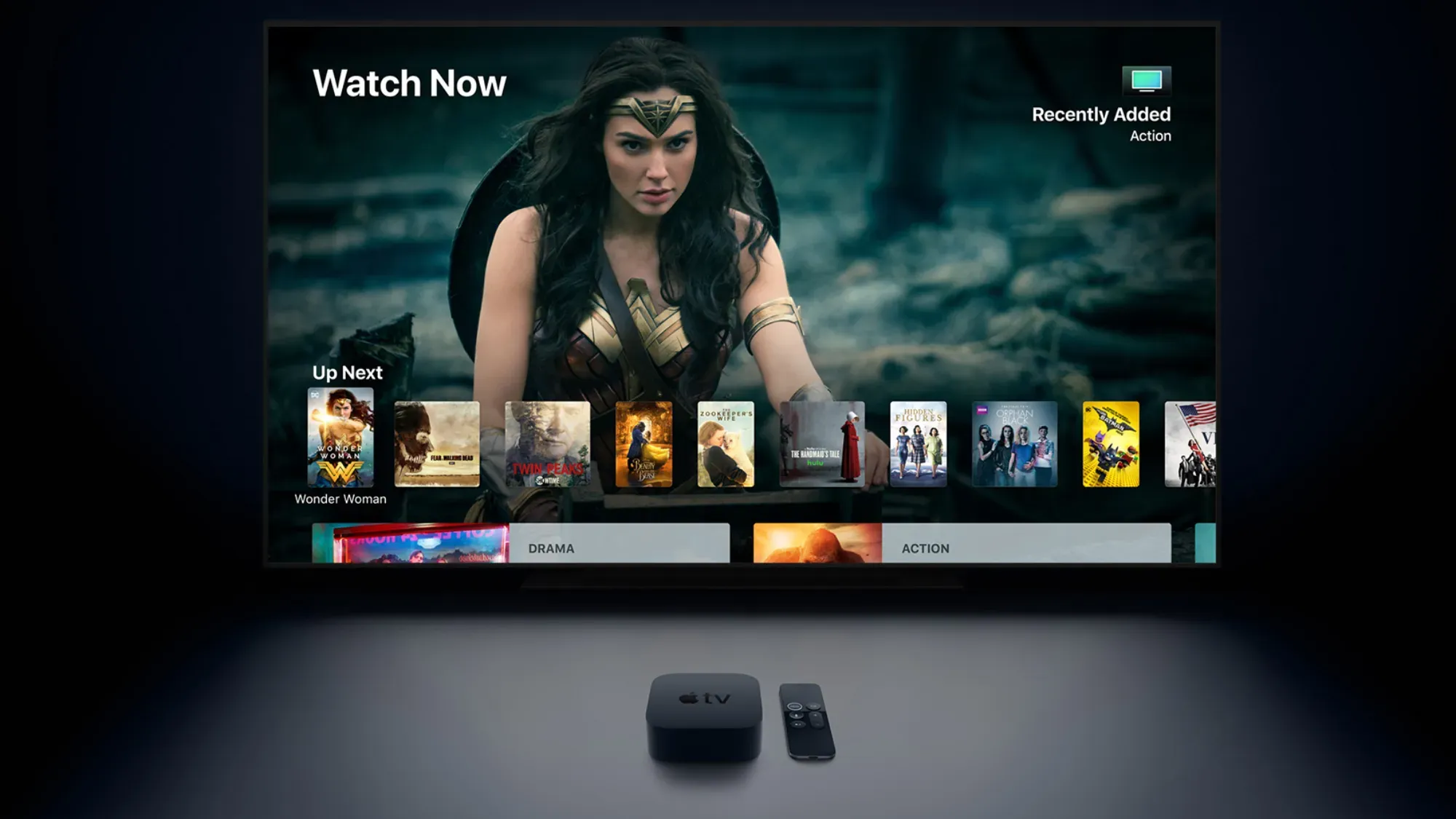 The Apple TV 4K In front of a screen showing wonder woman