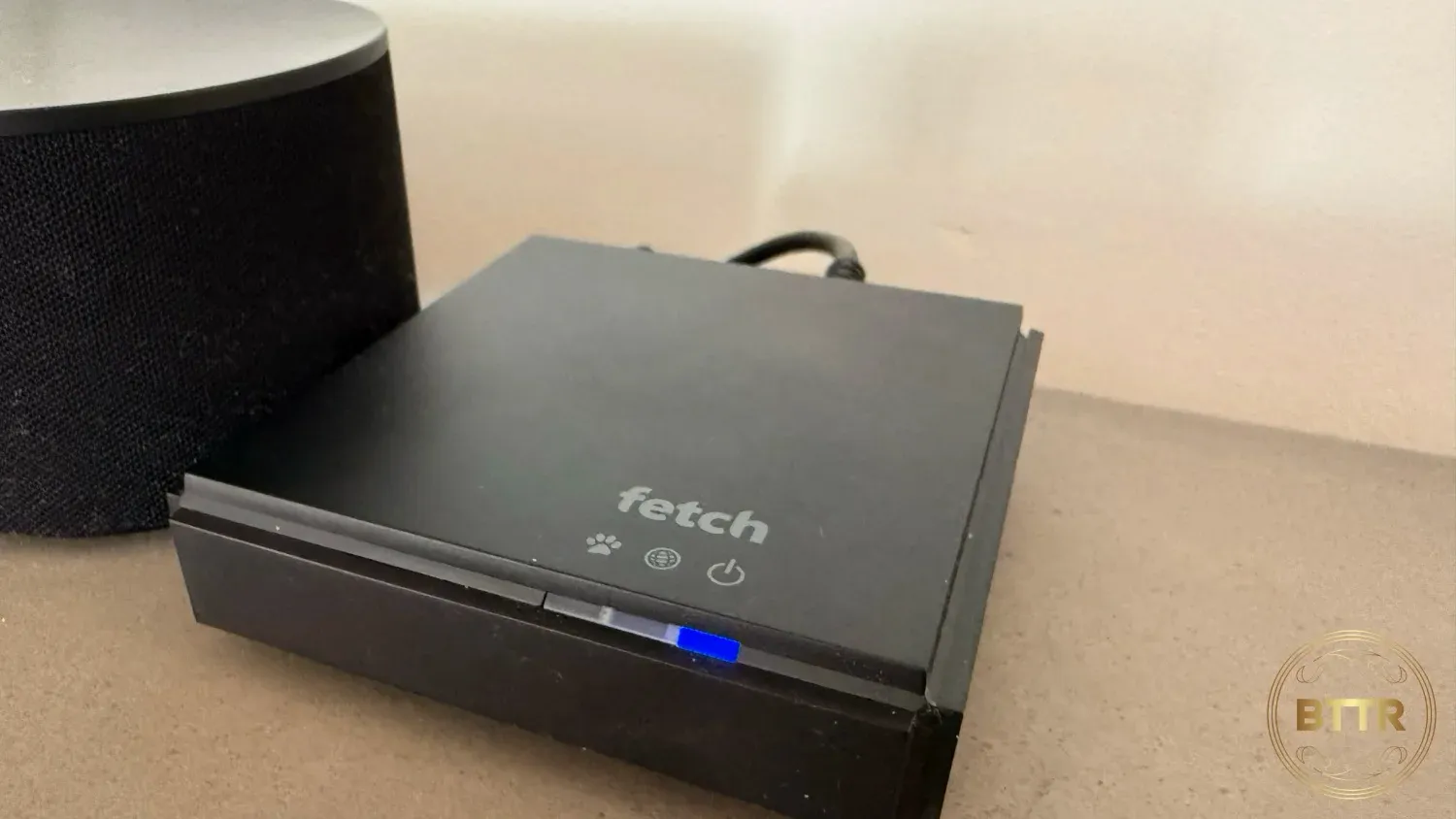 The Fetch Mini G5 on my entertainment unit next to my soundbar