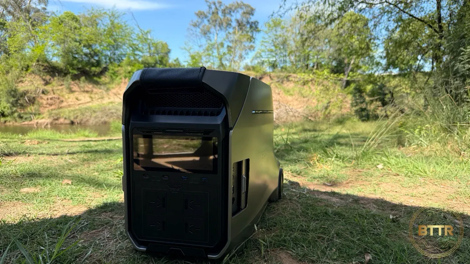 The Delta Pro 3 on the grass in front of the river