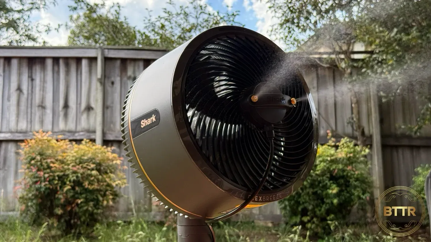 The misting attachment spraying water with the FlexBreeze